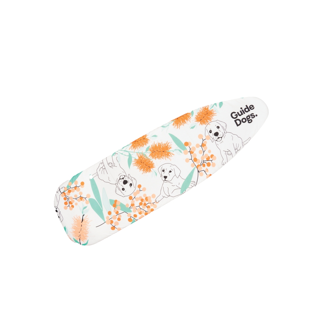 Ironing board cover with a floral and dog design, featuring the text Guide Dogs.