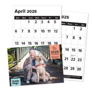 A 2025 Calendar showcasing an image of someone kneeling beside a guide dog on a bridge, with April and December 2025 pages in view.