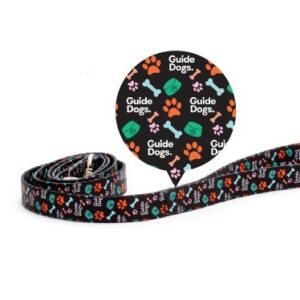 Dog Lead - Black with colorful paw prints and the words "Guide Dogs" on it.
