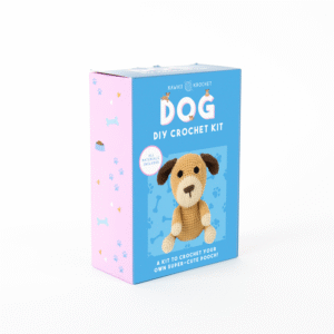 A blue and pink box labeled Crochet Kit features an image of a crocheted dog and states it includes all materials needed to make a cute dog toy.